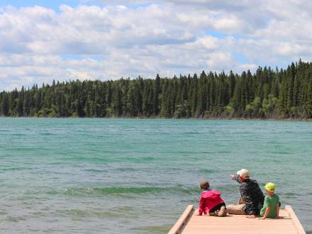 Sitting on the dock with the kids, watching the water at Duck Mountain Provincial Park