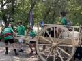 Youth Pulling Red River Cart