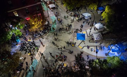 Crowds of people seen from above on the streets of Winnipeg's Exchange District for Nuit Blanche.