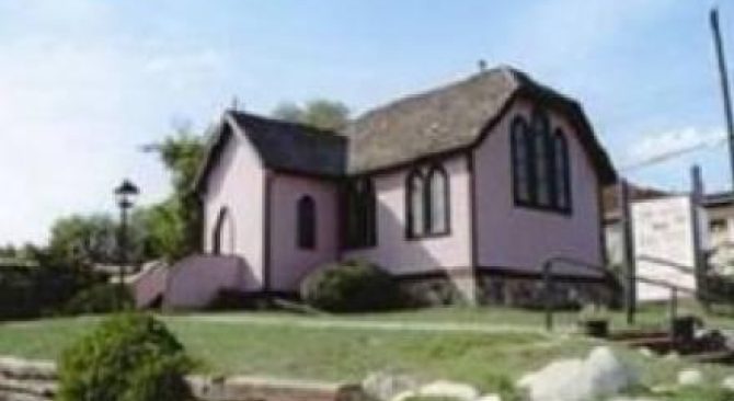 Souris Heritage Church Museum featuring 'Plum 1883,' a cherished symbol of history and community, encapsulating heritage.