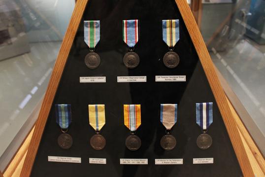 A display of diverse medals and honors bestowed upon soldiers, representing their valor, dedication to servicing our country.