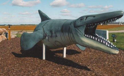 Roadside attraction of a full-size mosasaur in Morden.