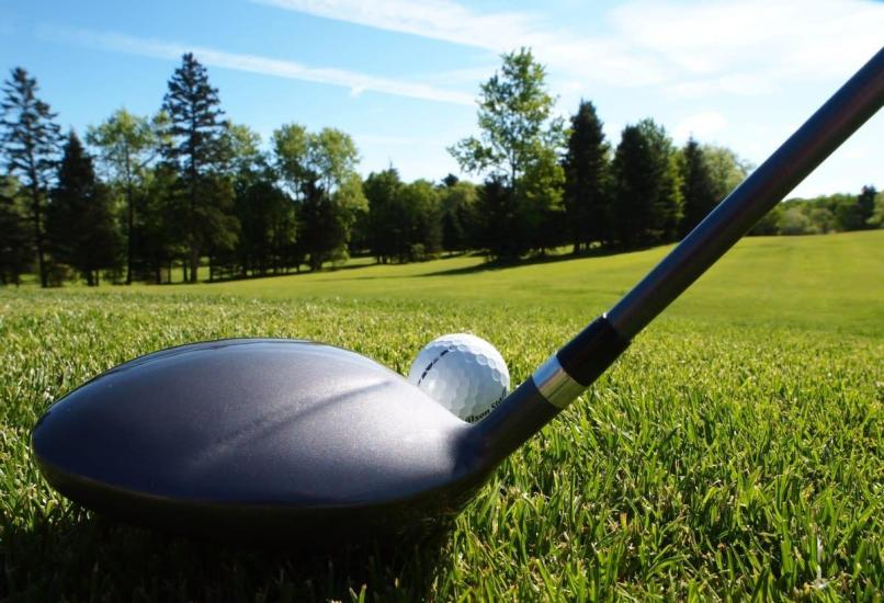 Glenboro Golf Course fairway shot with a rescue wood aiming for the green on a bright, sunny day.
