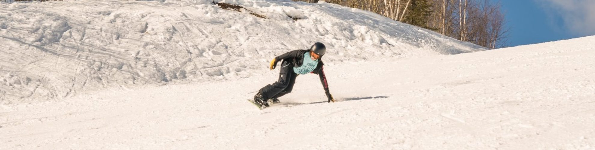 A person snowboarding at Mystery Mountain near Thompson.
