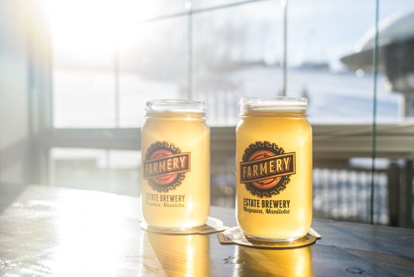 Two cold beers sitting on a table