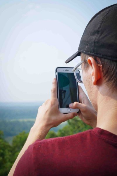A person takes a picture with a phone