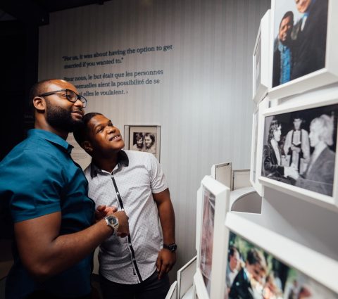 Two people viewing an exhibit at the Canadian Museum for Human Rights.