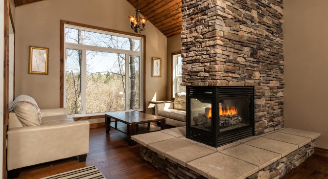 A cozy living room with a roaring fire.