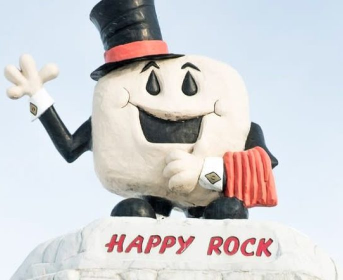Roadside attraction in Gladstone Manitoba: Happy Rock (smiling rock with a top hat).