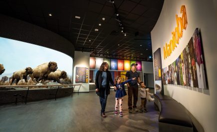 A family looking at the exhibits at the Manitoba Museum
