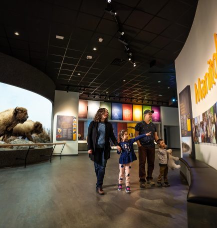 A family looking at the exhibits at the Manitoba Museum