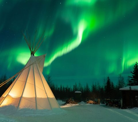 Tipi under the northern lights in Churchill.