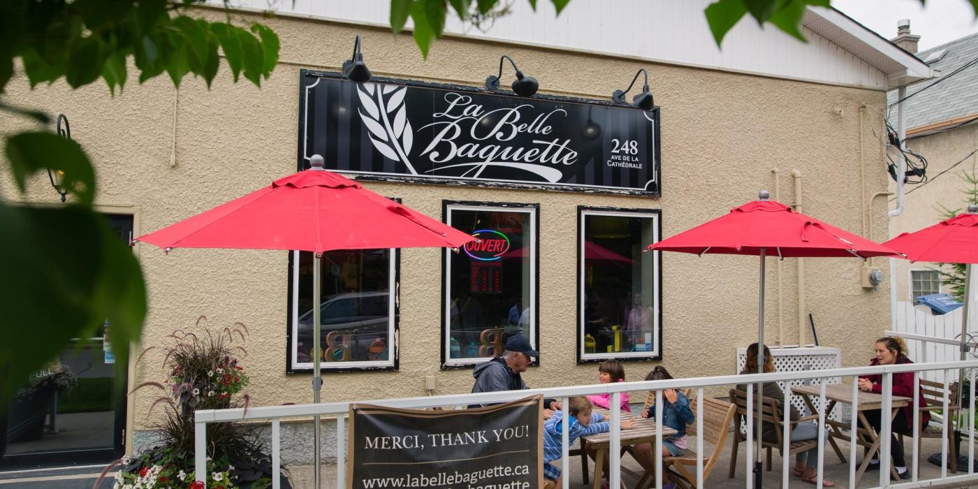 People sitting on the patio at La Belle Baguette.