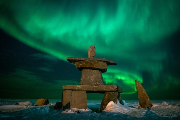An Inukshuk under the northern lights.