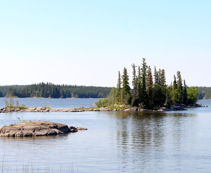 View of small rocky tree covered islands in Paint Lake.
