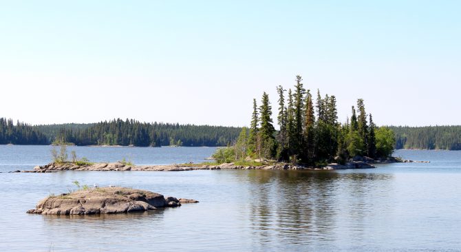 View of small rocky tree covered islands in Paint Lake.