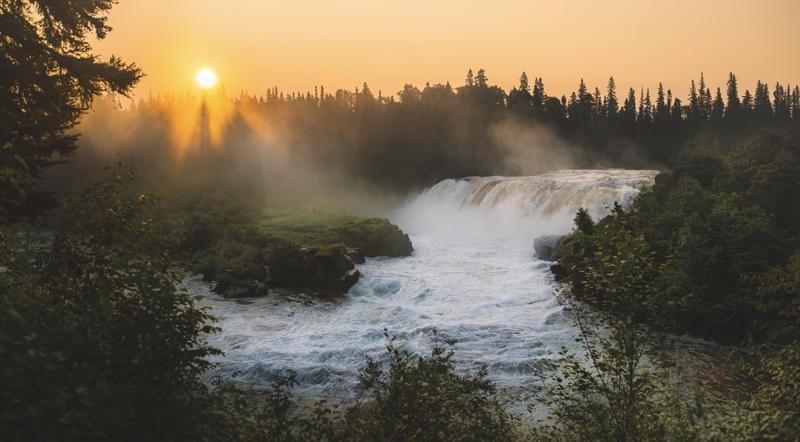Sunset through the rising mist at Pisew Falls.