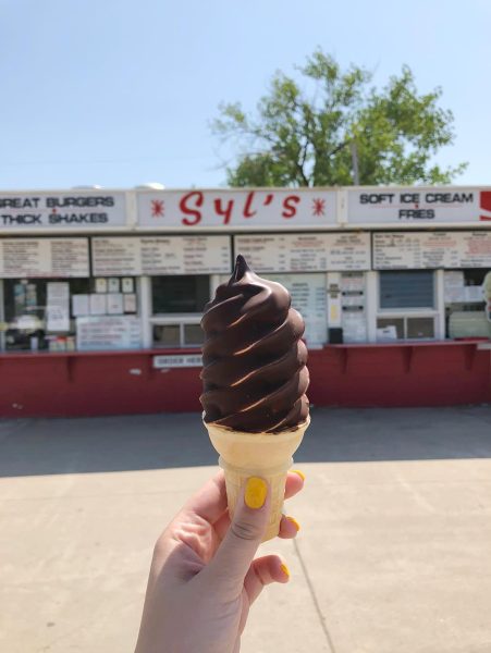 Holding up an ice cream cone from Syl's Drive In